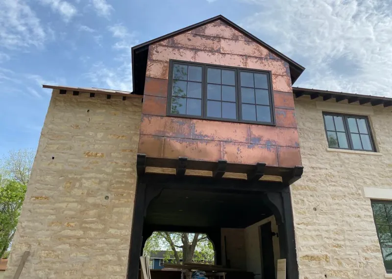 Copper metal panel facade on a stone building for Metal Roof Coating in Poolesville